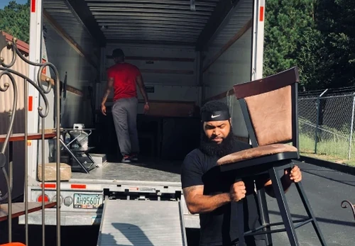 Workers moving furniture